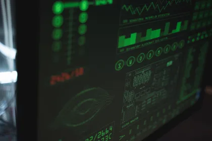 Green digital dashboard displaying system monitoring data, charts, and network security metrics.