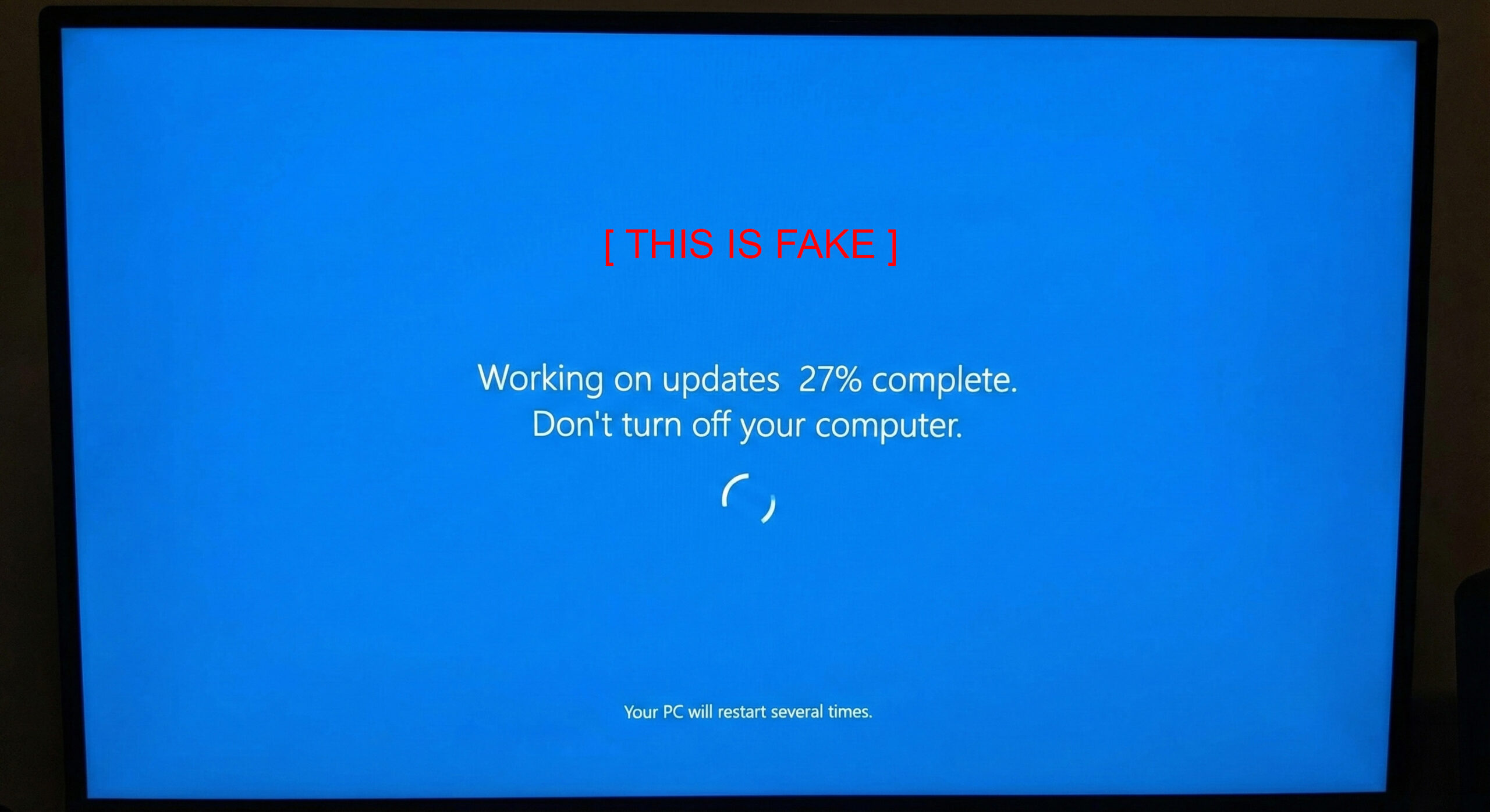 Full-screen fake Windows update overlay used to hide remote access activity from the user